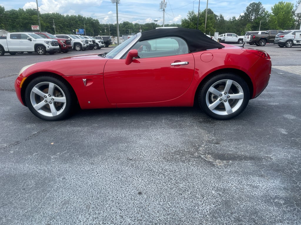 2007 Pontiac Solstice BASE in Aggressive (Victory Red) — front three-quarter view