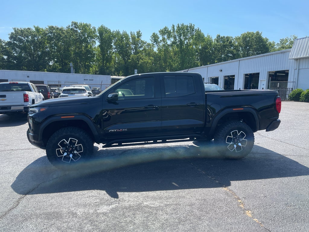 2026 GMC Canyon AT4X in Onyx Black — front three-quarter view